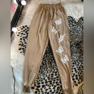 Tan butterfly sweat pants